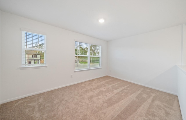 25713 Merino Ct, Magnolia, TX 77355 - empty room featuring light carpet and baseboards