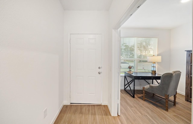 25713 Merino Ct, Magnolia, TX 77355 - entryway with light wood-style flooring and baseboards
