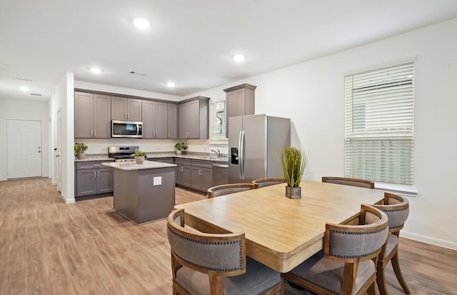25713 Merino Ct, Magnolia, TX 77355 - dining room featuring light wood finished floors and recessed lighting