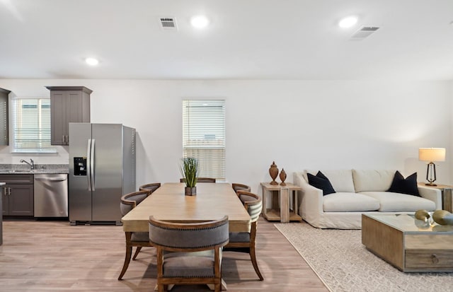 25713 Merino Ct, Magnolia, TX 77355 - dining area with light wood-type flooring and recessed lighting