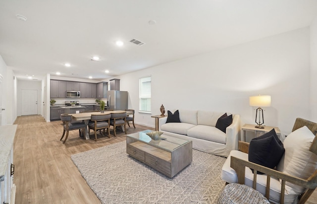 25713 Merino Ct, Magnolia, TX 77355 - living room featuring light wood-type flooring and recessed lighting