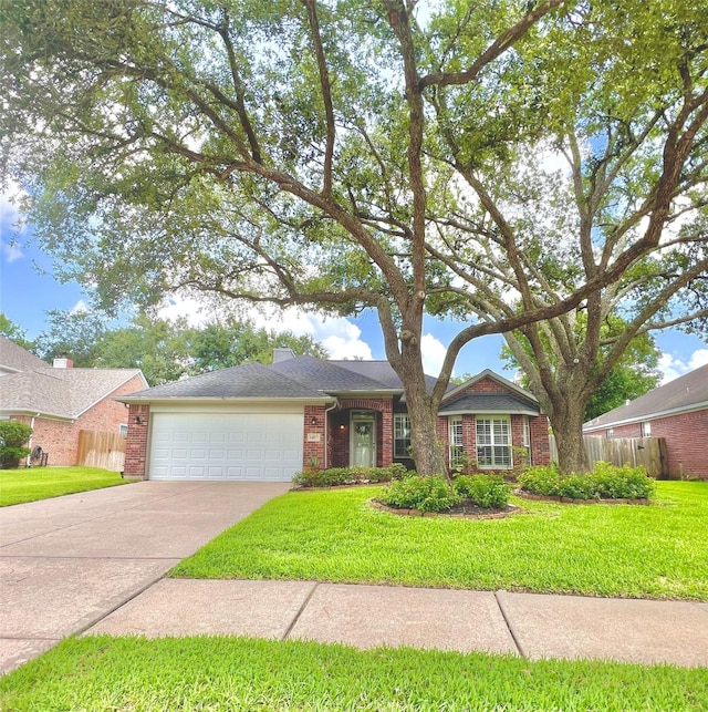 1407 Evening Cloud Ct, Katy, TX 77450 - single story home with brick siding, a garage, and concrete driveway