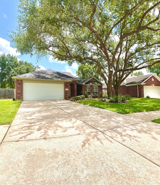 1407 Evening Cloud Ct, Katy, TX 77450 - view of front of property featuring concrete driveway, brick siding, and an attached garage