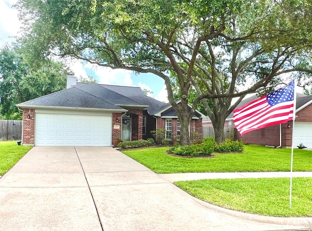 1407 Evening Cloud Ct, Katy, TX 77450 - view of front facade featuring concrete driveway, a garage, brick siding, and a chimney