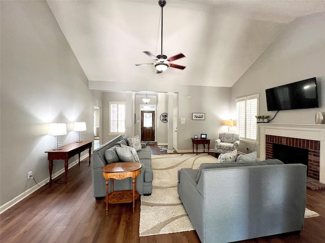 1407 Evening Cloud Ct, Katy, TX 77450 - living area featuring a ceiling fan, high vaulted ceiling, wood finished floors, and a brick fireplace