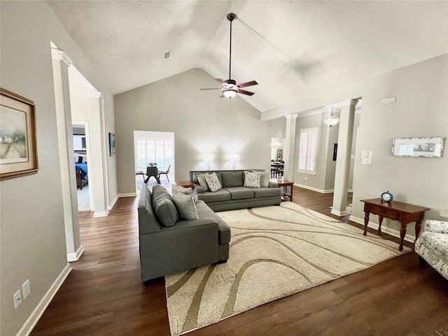 1407 Evening Cloud Ct, Katy, TX 77450 - living area with ornate columns, a ceiling fan, vaulted ceiling, healthy amount of natural light, and dark wood-style flooring