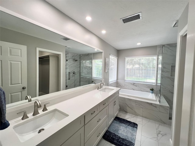 1407 Evening Cloud Ct, Katy, TX 77450 - full bathroom with marble finish flooring, a garden tub, a marble finish shower, double vanity, and recessed lighting