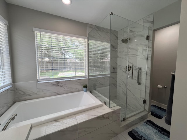 1407 Evening Cloud Ct, Katy, TX 77450 - bathroom with healthy amount of natural light, a bath, a marble finish shower, and recessed lighting