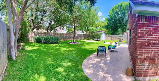 1407 Evening Cloud Ct, Katy, TX 77450 - fenced backyard featuring a storage unit and a patio