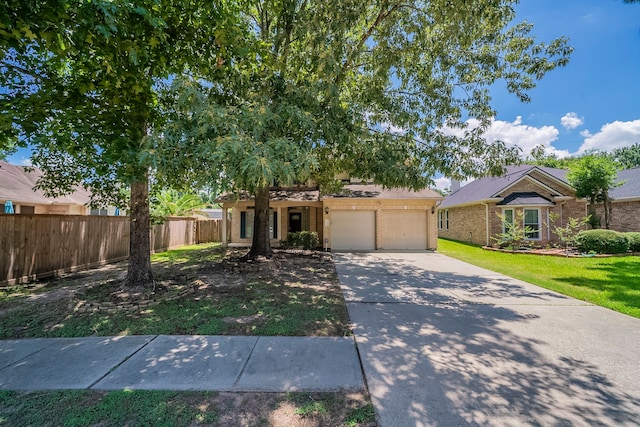 13430 Magnolia Crest Ln, Houston, TX 77070 - view of front of house featuring concrete driveway and brick siding