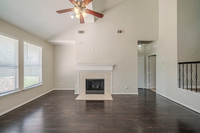 13430 Magnolia Crest Ln, Houston, TX 77070 - unfurnished living room with high vaulted ceiling, ceiling fan, wood finished floors, and a tile fireplace