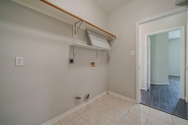 13430 Magnolia Crest Ln, Houston, TX 77070 - washroom featuring washer hookup, gas dryer hookup, light tile patterned floors, and electric dryer hookup