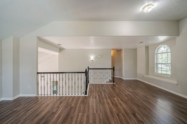 13430 Magnolia Crest Ln, Houston, TX 77070 - spare room featuring dark wood-type flooring and lofted ceiling