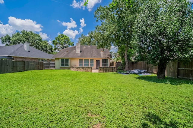 13430 Magnolia Crest Ln, Houston, TX 77070 - rear view of house with a fenced backyard and a chimney