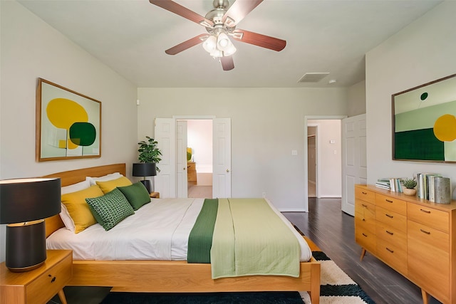 13430 Magnolia Crest Ln, Houston, TX 77070 - bedroom featuring dark wood-type flooring, ceiling fan, and ensuite bath