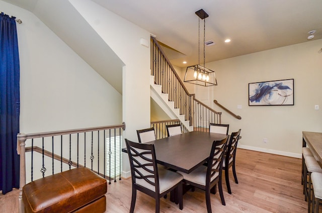 4915 Ave J, Houston, TX 77011 - dining room featuring wood finished floors, a chandelier, recessed lighting, and lofted ceiling