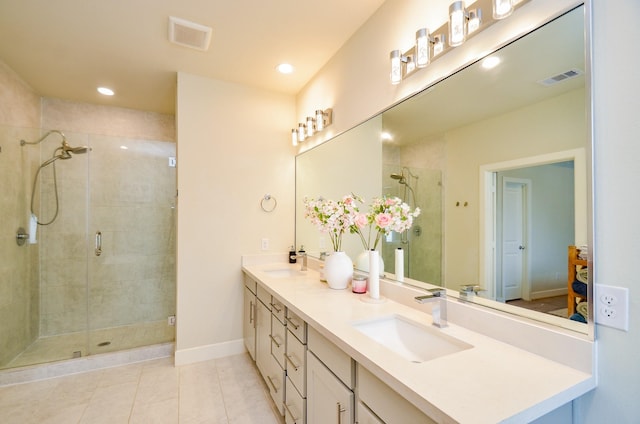 4915 Ave J, Houston, TX 77011 - bathroom featuring double vanity, a shower stall, tile patterned floors, and recessed lighting