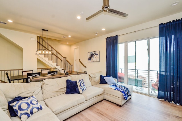 4915 Ave J, Houston, TX 77011 - living room with a ceiling fan, wood finished floors, recessed lighting, and stairs
