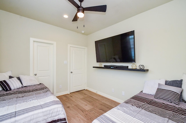 4915 Ave J, Houston, TX 77011 - bedroom featuring light wood-type flooring, a ceiling fan, and recessed lighting