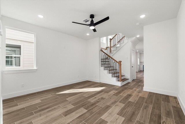 131 S Virginia Ave, La Porte, TX 77571 - empty room with a ceiling fan, wood finished floors, stairs, recessed lighting, and a smoke detector