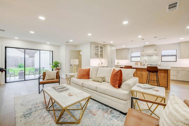 2831 Shadowdale Dr, Houston, TX 77043 - living area with light wood-style flooring and recessed lighting