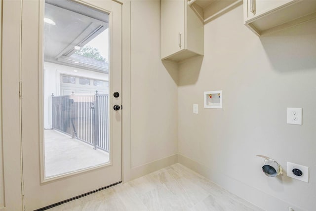 2831 Shadowdale Dr, Houston, TX 77043 - laundry area with electric dryer hookup, cabinet space, hookup for a washing machine, and light marble finish flooring