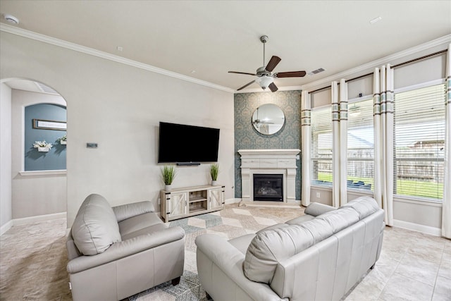 19427 Stanton Lake Dr, Cypress, TX 77433 - living area with crown molding, ceiling fan, arched walkways, and a large fireplace