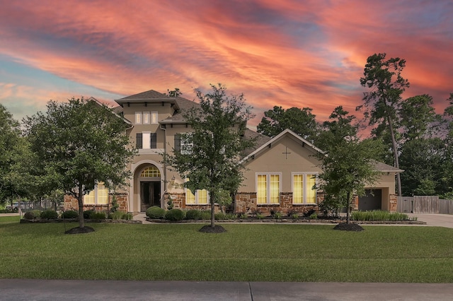 3403 Wooded Ln, Conroe, TX 77301 - mediterranean / spanish home with stone siding, stucco siding, driveway, and an attached garage