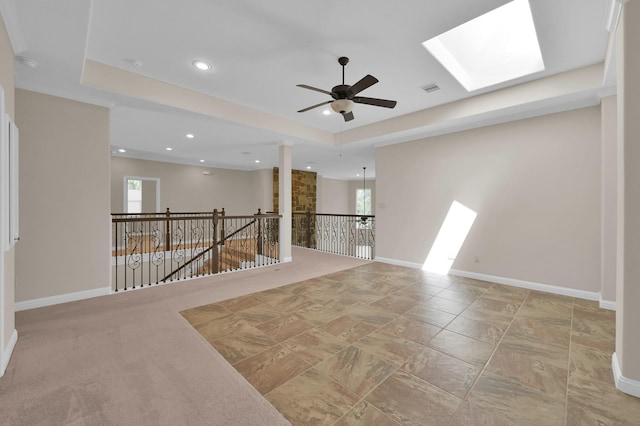 3403 Wooded Ln, Conroe, TX 77301 - spare room with ceiling fan, a raised ceiling, recessed lighting, and a skylight