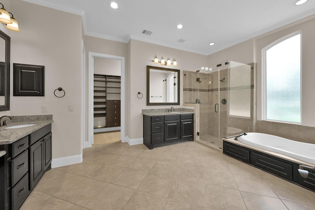 3403 Wooded Ln, Conroe, TX 77301 - bathroom featuring two vanities, a shower stall, a bath, ornamental molding, and tile patterned flooring