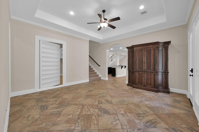 3403 Wooded Ln, Conroe, TX 77301 - unfurnished room with a raised ceiling, ceiling fan, arched walkways, recessed lighting, and stairs