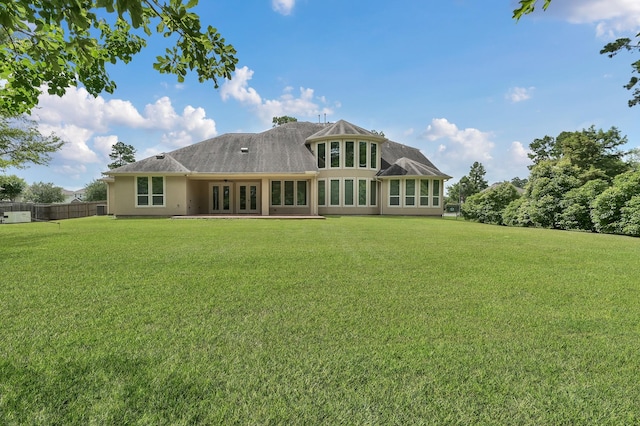 3403 Wooded Ln, Conroe, TX 77301 - rear view of property with french doors and stucco siding