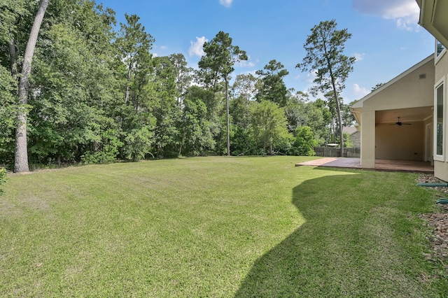 3403 Wooded Ln, Conroe, TX 77301 - view of yard featuring ceiling fan and a patio