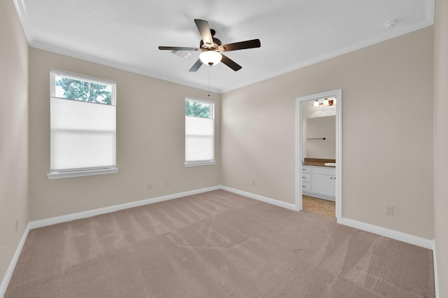 3403 Wooded Ln, Conroe, TX 77301 - unfurnished bedroom with light colored carpet, ornamental molding, ensuite bathroom, and a ceiling fan