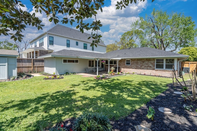 2007 Lamonte Ln, Houston, TX 77018 - rear view of house with a fenced backyard, a patio area, a shed, and brick siding