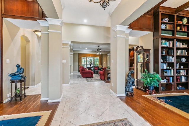 7826 Camden Hollow Ln, Humble, TX 77396 - foyer entrance with ceiling fan, ornate columns, light wood-type flooring, crown molding, and recessed lighting