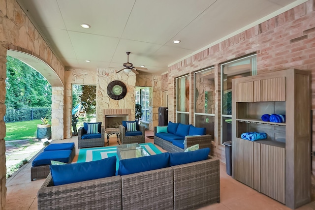 7826 Camden Hollow Ln, Humble, TX 77396 - view of patio / terrace with an outdoor living space with a fireplace and ceiling fan