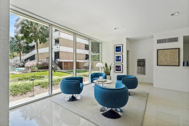 3600 Montrose Blvd Unit 209, Houston, TX 77006 - sitting room featuring heating unit and a wall of windows
