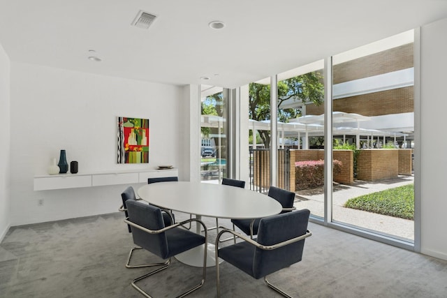 3600 Montrose Blvd Unit 209, Houston, TX 77006 - dining area featuring carpet, a wall of windows, and recessed lighting