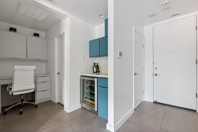 3600 Montrose Blvd Unit 209, Houston, TX 77006 - unfurnished office featuring wine cooler, a bar, and light tile patterned floors
