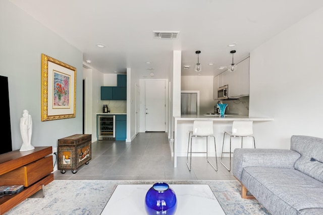 3600 Montrose Blvd Unit 209, Houston, TX 77006 - tiled living area featuring beverage cooler and recessed lighting