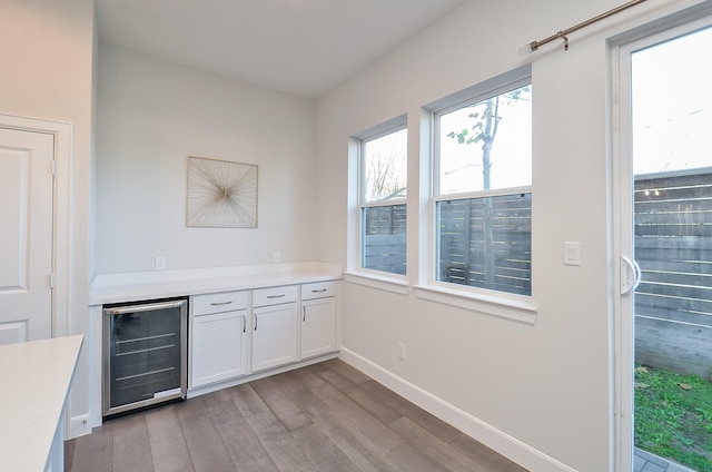 9577 Neuens Rd Unit F, Houston, TX 77080 - bar featuring wine cooler and wood finished floors