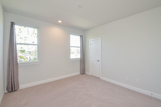 9577 Neuens Rd Unit F, Houston, TX 77080 - empty room with light carpet and recessed lighting