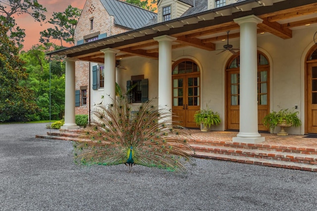 3 E Rivercrest Dr, Houston, TX 77042 - exterior entry at dusk with stucco siding