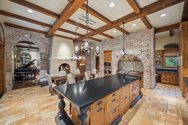 3 E Rivercrest Dr, Houston, TX 77042 - kitchen with arched walkways, a chandelier, stainless steel appliances, dark countertops, and beamed ceiling