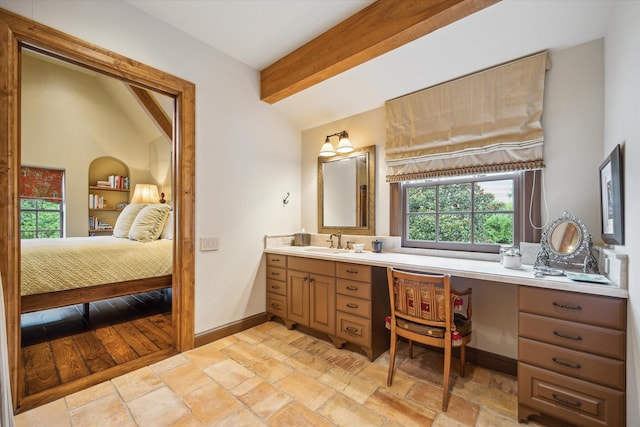 3 E Rivercrest Dr, Houston, TX 77042 - bathroom with beamed ceiling, plenty of natural light, vanity, stone tile flooring, and ensuite bathroom