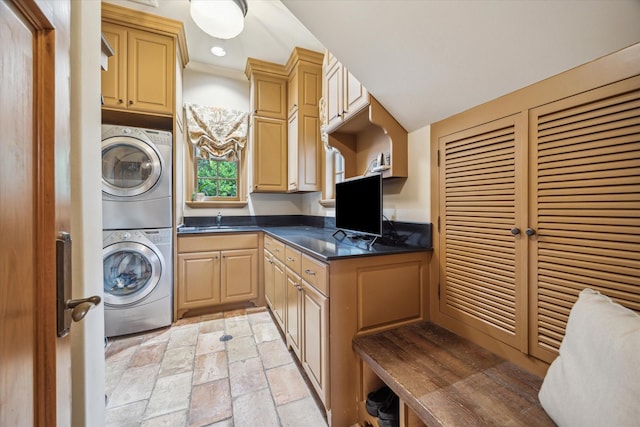 3 E Rivercrest Dr, Houston, TX 77042 - laundry room with stacked washer / drying machine, cabinet space, light stone finish floors, and recessed lighting
