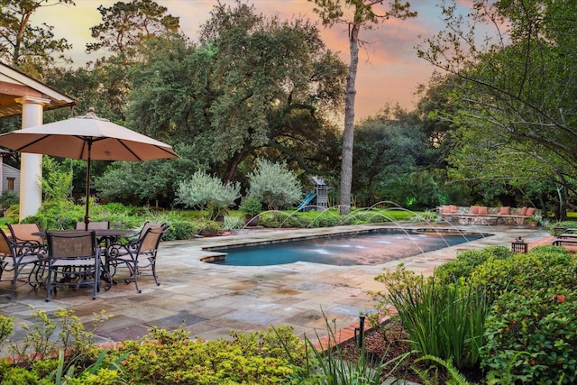 3 E Rivercrest Dr, Houston, TX 77042 - swimming pool featuring a patio area and view of wooded area