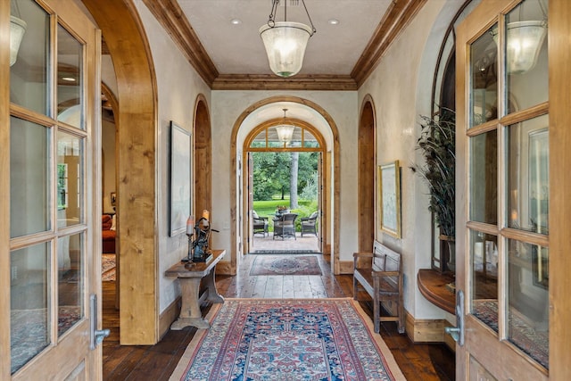 3 E Rivercrest Dr, Houston, TX 77042 - entryway featuring crown molding, dark wood-style floors, arched walkways, and french doors