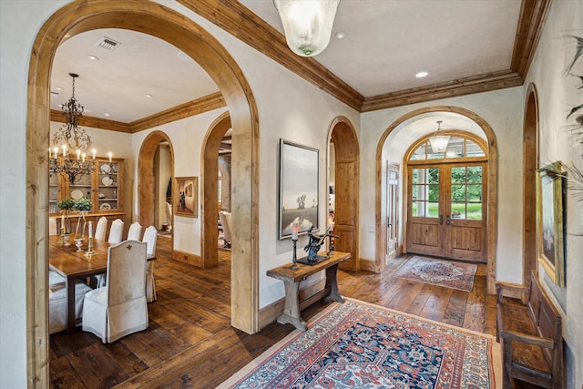 3 E Rivercrest Dr, Houston, TX 77042 - foyer featuring arched walkways, hardwood / wood-style floors, a chandelier, crown molding, and recessed lighting